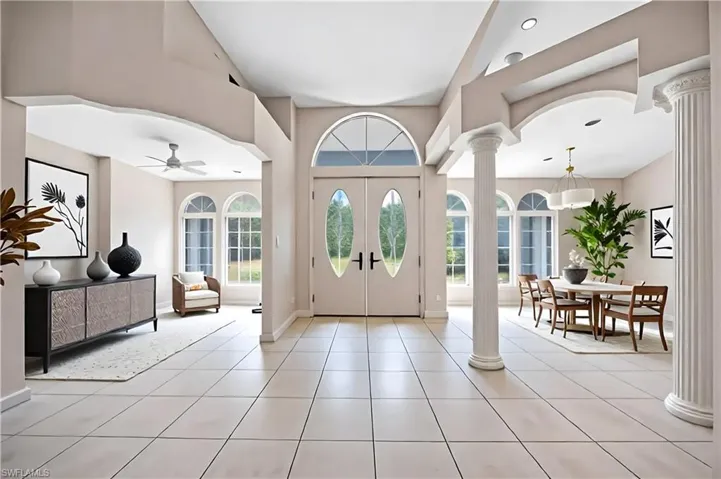 Foyer Entry Staged, Den on left, Formal Dinning right