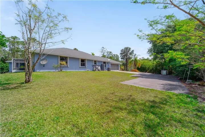 View Left Side of Home & Garage