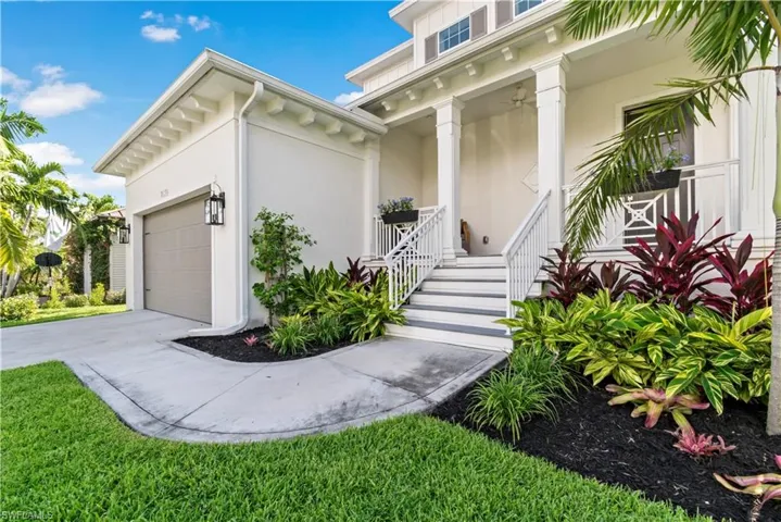 View of front of house with covered porch and a garage