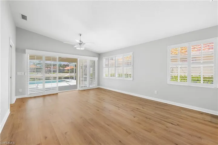 Living room with ceiling fan, healthy amount of natural light