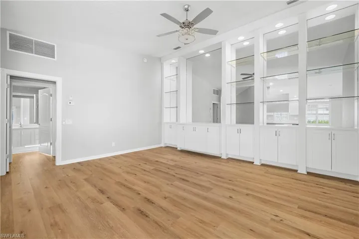 Dinning room with built in wall units, with vaulted ceilings