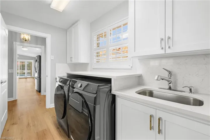 Laundry area with washer and dryer, cabinet space, and pantry