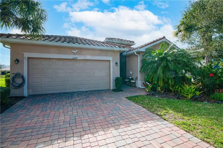 Spacious 2 car garage with paver driveway