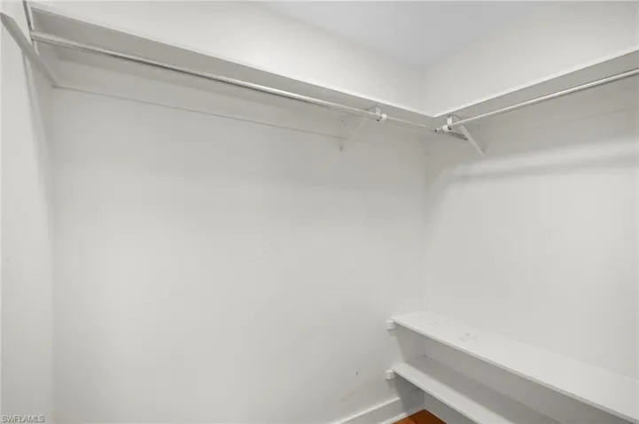 Walk in closet featuring wood finished floors