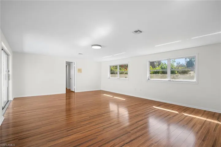 Empty room featuring wood finished floors and baseboards