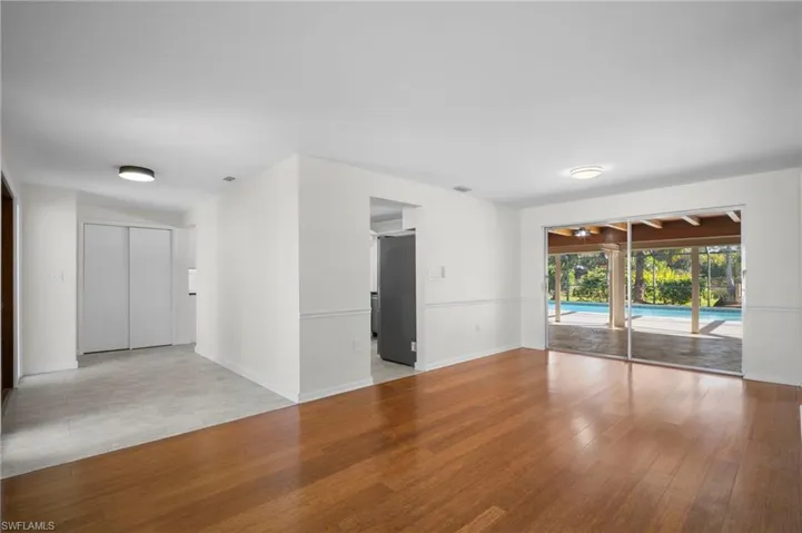 Unfurnished room with light wood-style floors and a sunroom