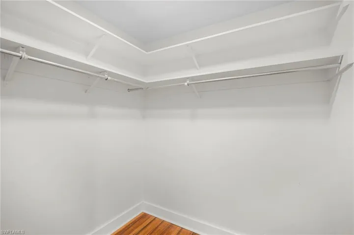 Walk in closet featuring wood finished floors