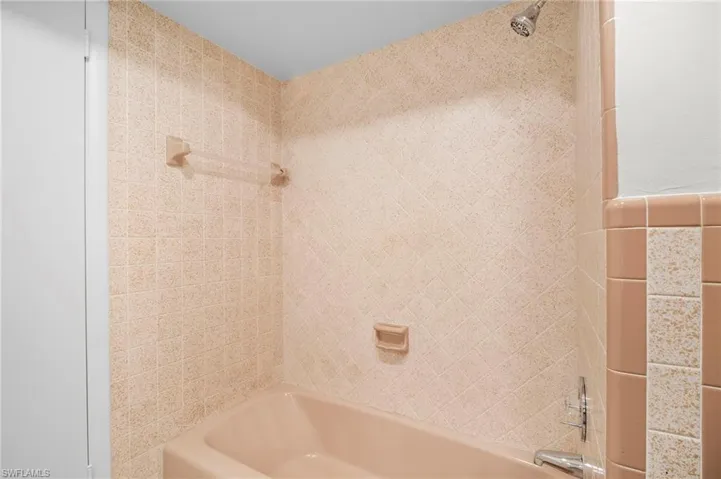 Full bathroom with shower / washtub combination