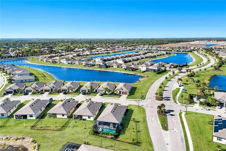 Aerial perspective of suburban area with a large body of water