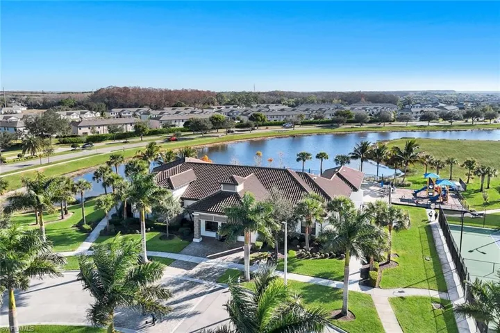 Aerial view of residential area featuring a large body of water