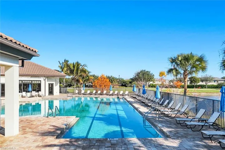Community pool with a patio