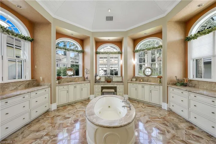 Primary en suite bathroom with HUGE walk in shower and soaking tub.  So many lovely details here.