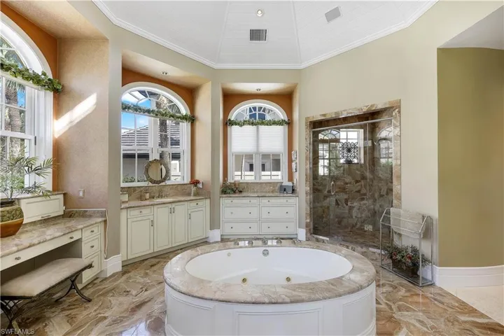 There is plenty of natural light in the primary bathroom.