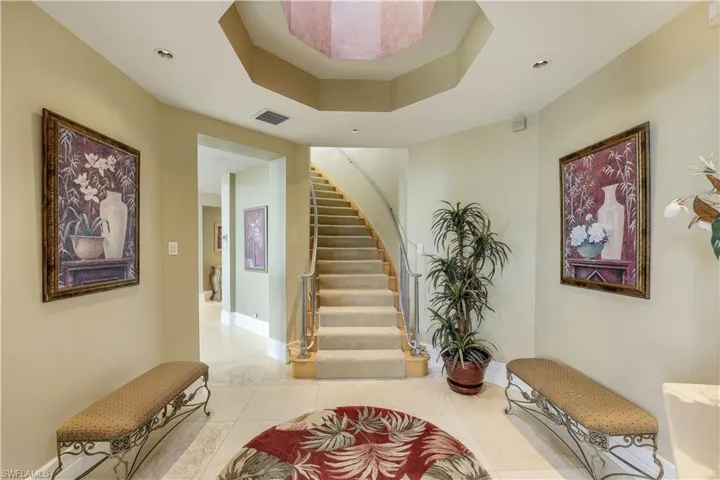 The grand staircase - just upstairs is a balcony overlooking the living room and the office/den of your dreams!