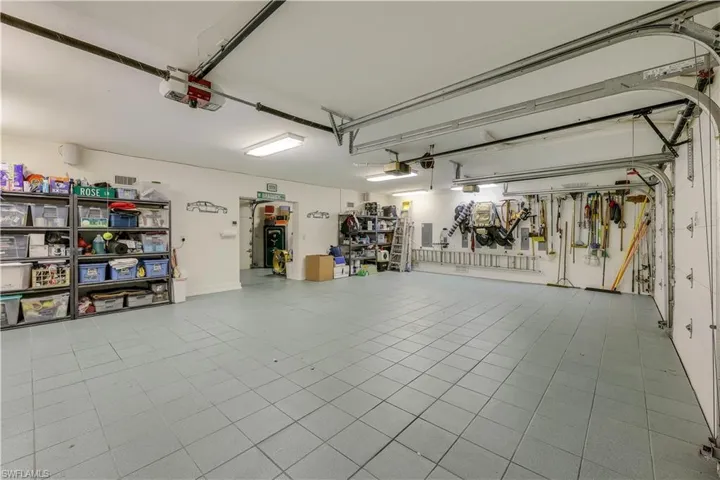 THREE CAR PLUS garage with workroom behind the garage. There is even an automatic door in the workroom that opens to the outside. Makes it a breeze to load up the boat for a day of surf and sun!