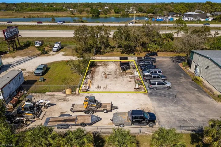 50x75 personal fenced in lot. Aerial view featuring a water view