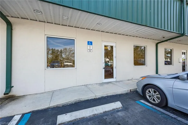 Property entrance with stucco siding