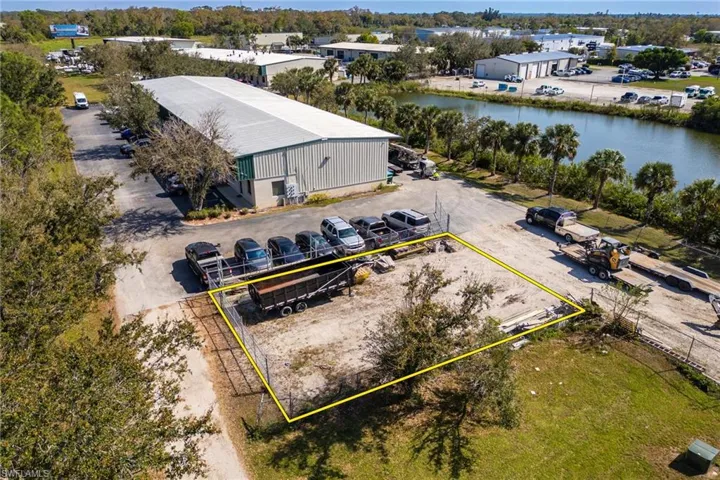 50x75 personal fenced in lot. Birds eye view of property featuring a water view