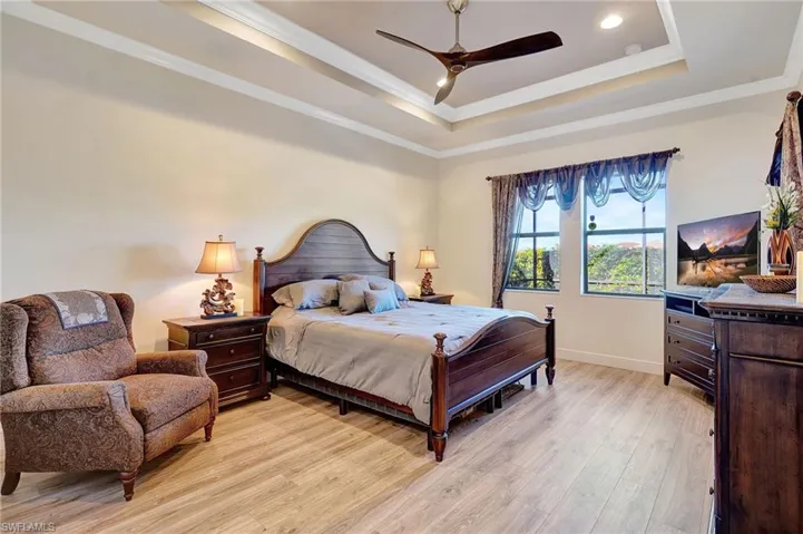primary bedroom with 2 walk-in closets and luxury bath