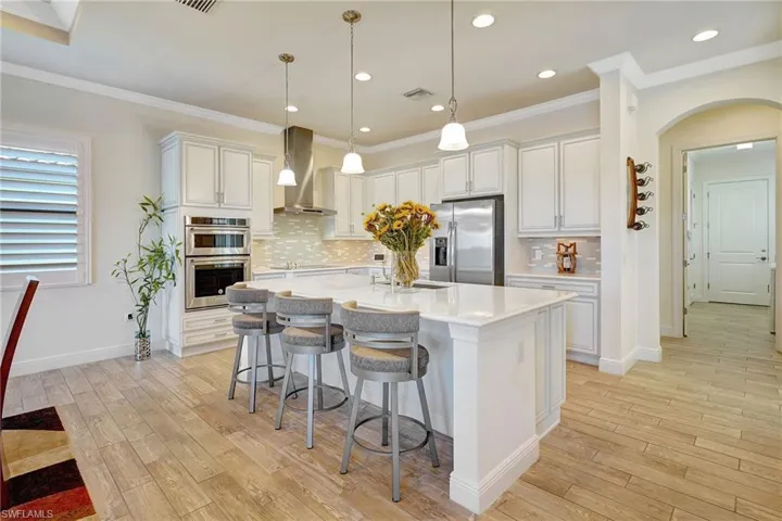 cooks kitchen with huge island & breakfast bar
