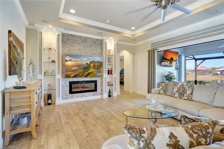with custom stone fireplace and glass shelving