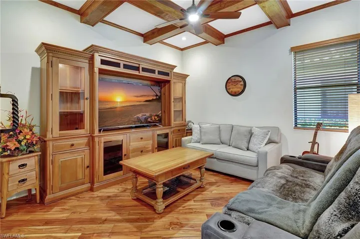 Flex space with wood accent ceiling and barn door