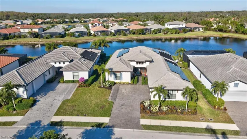 Gorgeous Estate home on waterfront, cul-de-sac lot with solar power, front porch, 3+ car garage, storm protection, sealed paver driveway, ENDLESS UPGRADES!