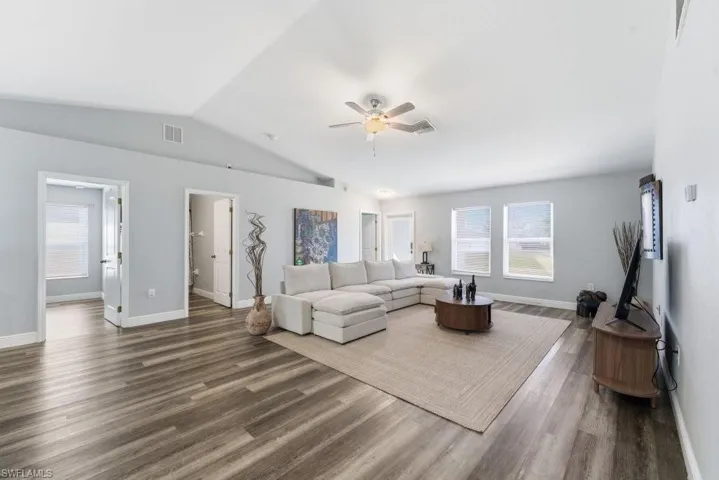 Living area featuring ceiling fan and wood finished floors