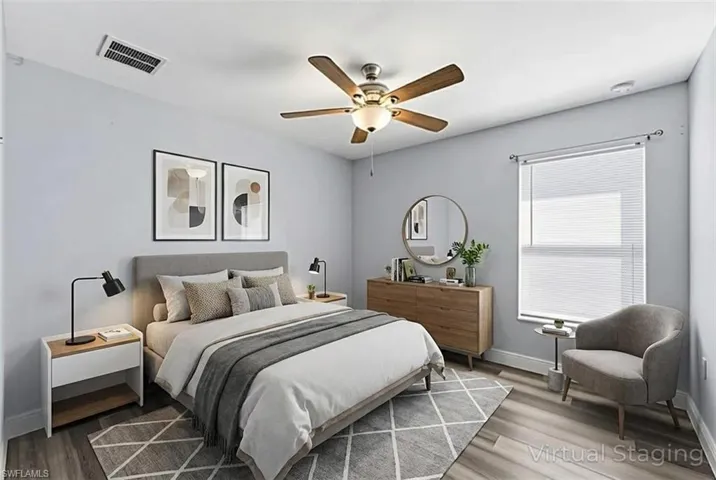 Bedroom with wood finished floors and a ceiling fan