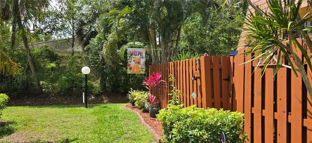 View of yard featuring fence