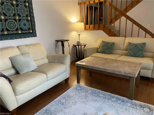 Living room featuring dark hardwood / wood-style flooring