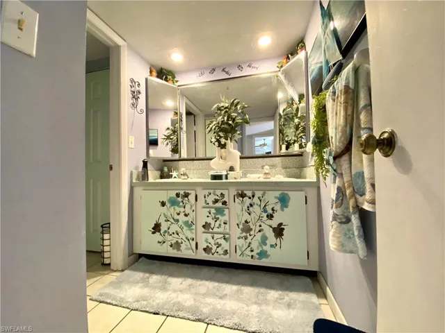 Bathroom featuring vanity and tile patterned flooring