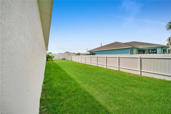 View of fenced backyard