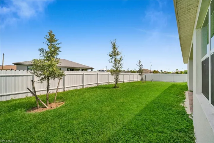 View of fenced backyard
