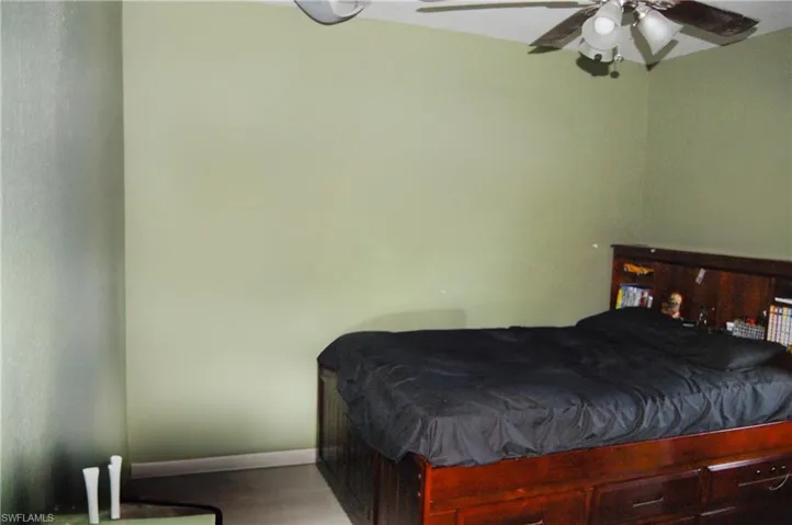 Bedroom with light wood-type flooring and ceiling fan