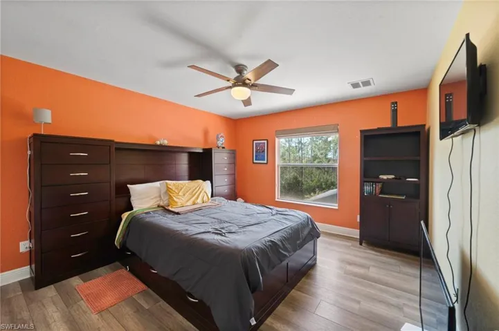 Bedroom featuring light wood-type flooring and ceiling fan