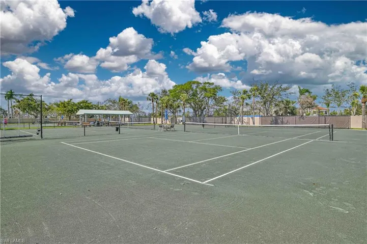 View of tennis court featuring community basketball court