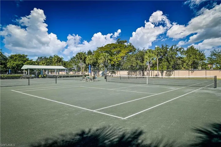 View of tennis court with community basketball court