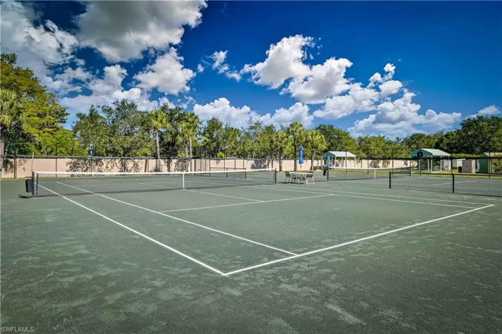View of tennis court featuring community basketball court