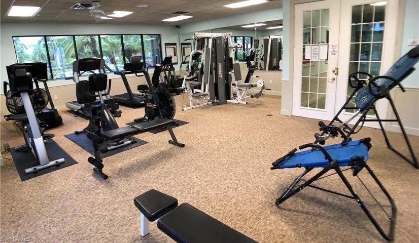 Workout area featuring a drop ceiling