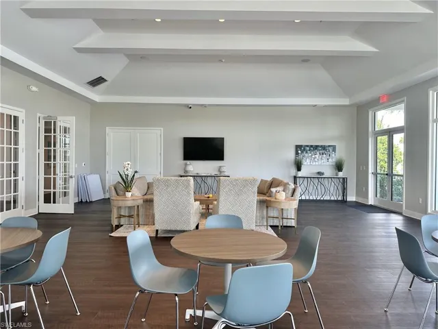 Dining area with french doors, dark wood-style flooring, vaulted ceiling, and recessed lighting