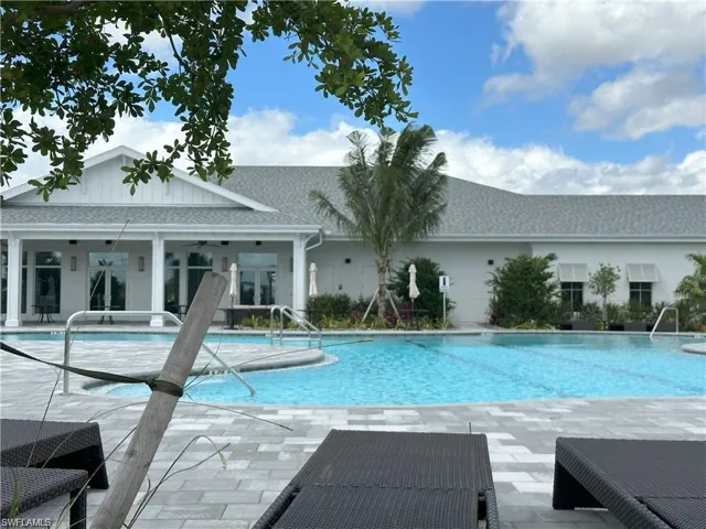 Community pool featuring a patio