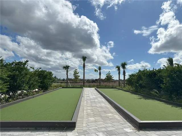 View of home's community with a bocce ball area