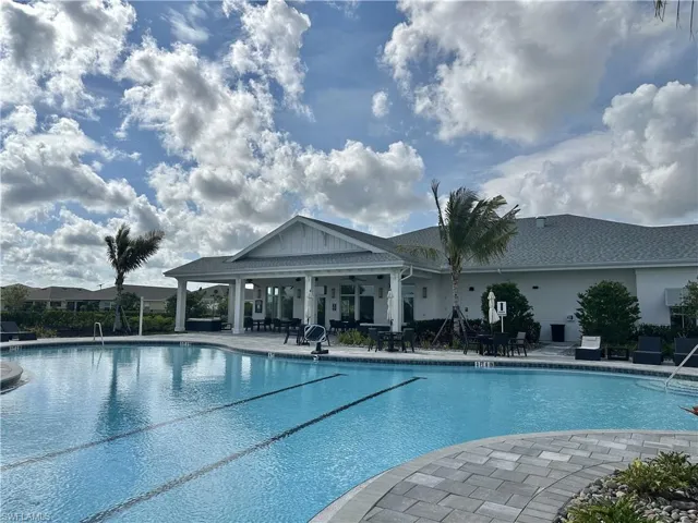 Community pool featuring a patio area