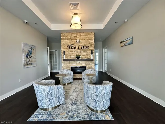 Sitting room featuring a brick fireplace
