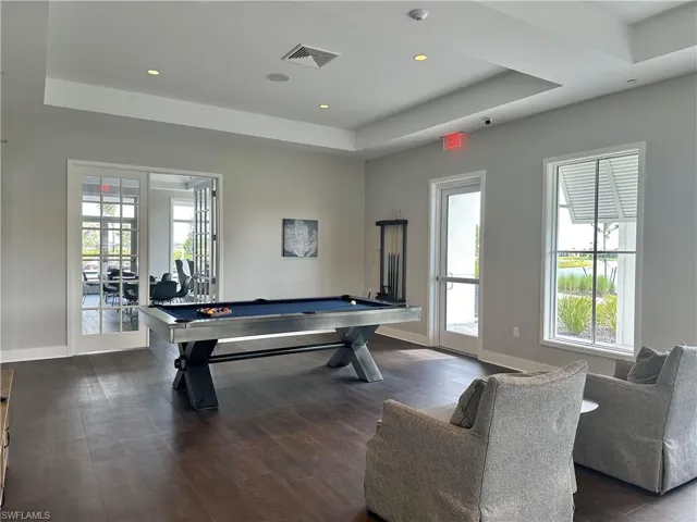 Recreation room with billiards table and recessed lighting