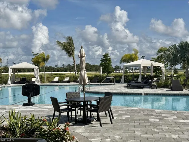 Community pool with a gazebo and a patio