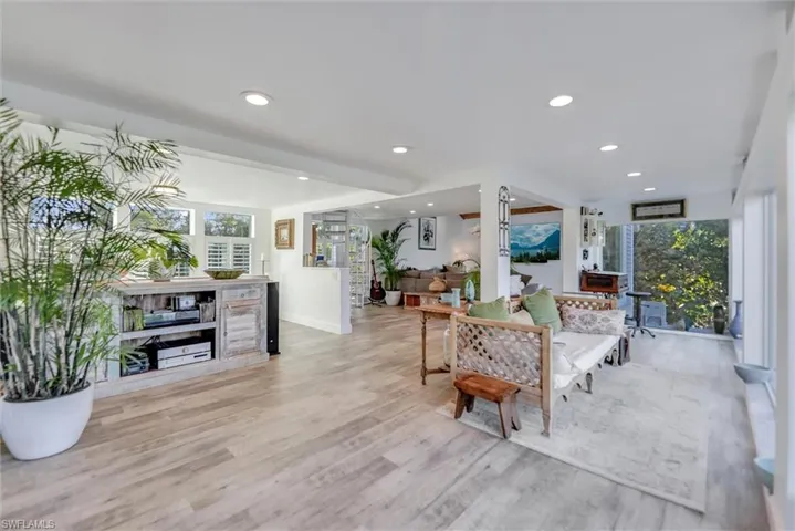 Living room featuring recessed lighting and light wood-type flooring