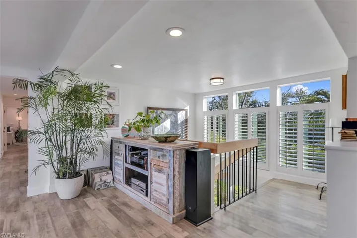 Kitchen with light wood-type flooring and recessed lighting