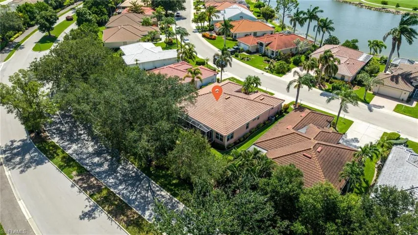 Residential property featuring a tile roof and stucco exterior